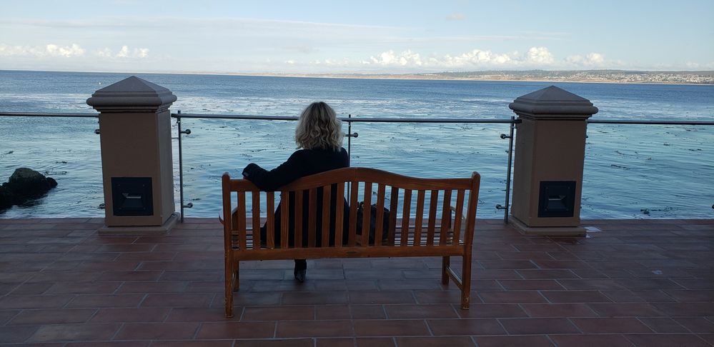 Iryna enjoys a peaceful moment on the Monterey Bay.