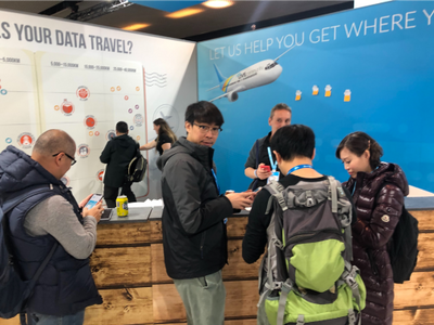 Kim talking with attendees at the LIVEcommunity booth during Ignite '19 Europe
