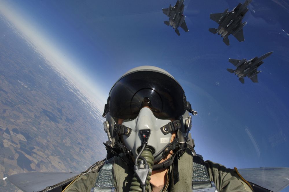 Self_cockpit_view_and_three-ship_formation_of_F-15E.jpg