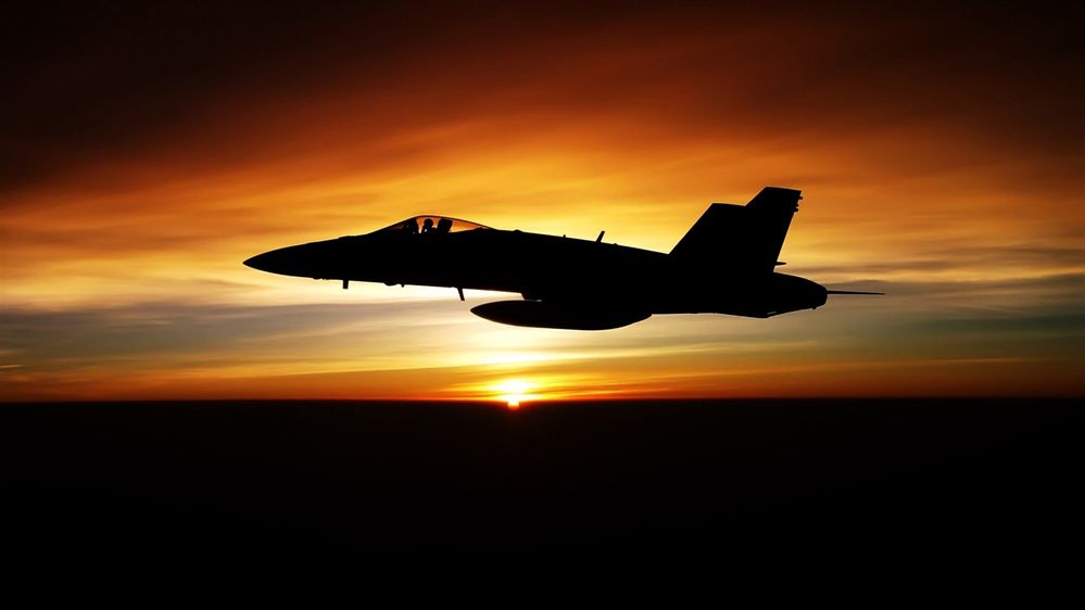 Fighter-flying-in-dusk-sky_1920x1080.jpg